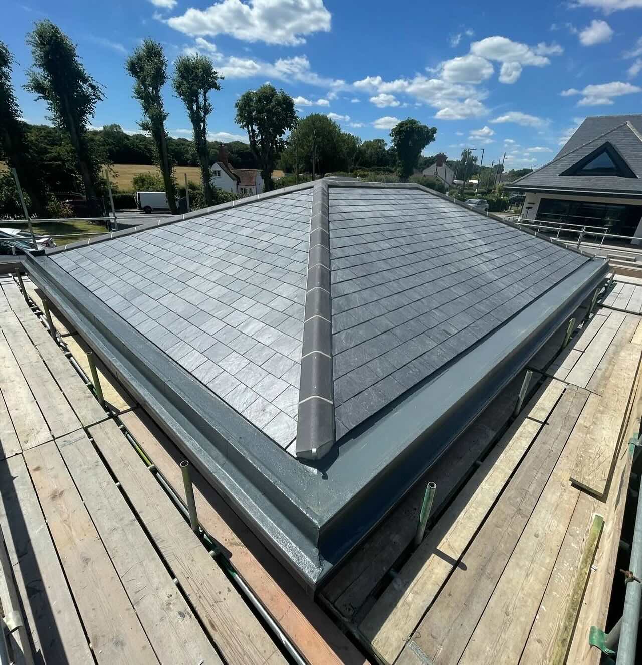 Natural Spanish Slate roof with GRP perimeter raking gutters